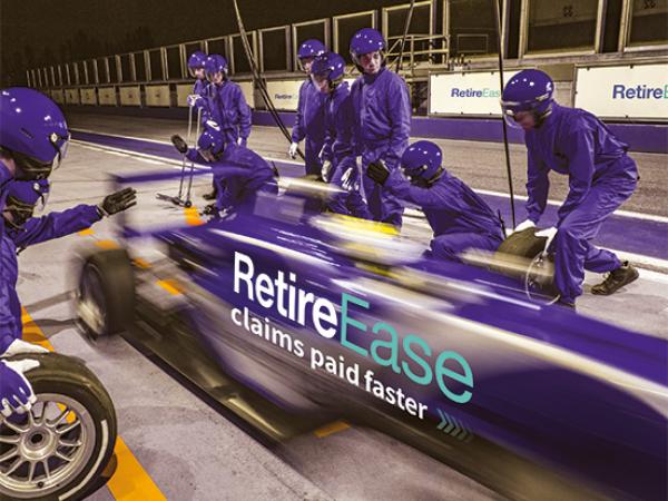 An image of a racing care in a pit stop, with "RetireEase - claims paid faster" on the side