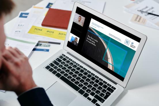 person watching webinar on laptop