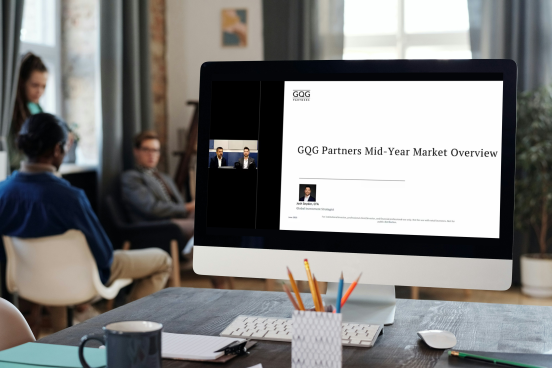 A photo of a computer monitor with a webinar in progress on the screen