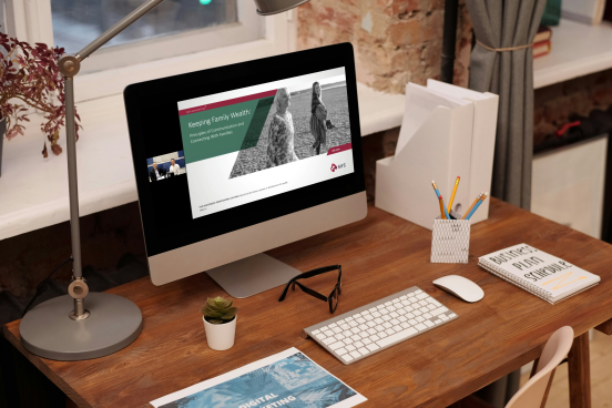 A photo of a computer monitor with a webinar in progress on the screen