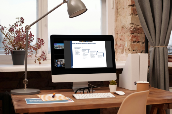 A photo of a computer monitor with a webinar in progress on the screen