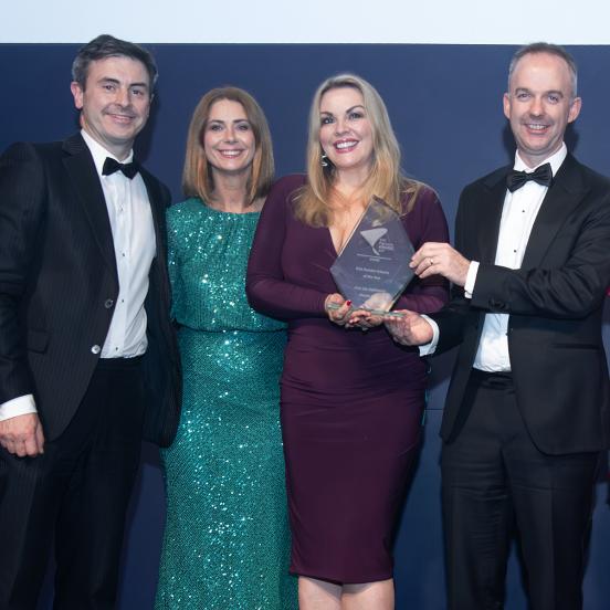 Damian Fadden, Tara de Buitlear, Susan Jackon and Oisin O'Shaughnessy posing with an award